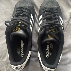 Adidas Superstar sneakers in black with white strips